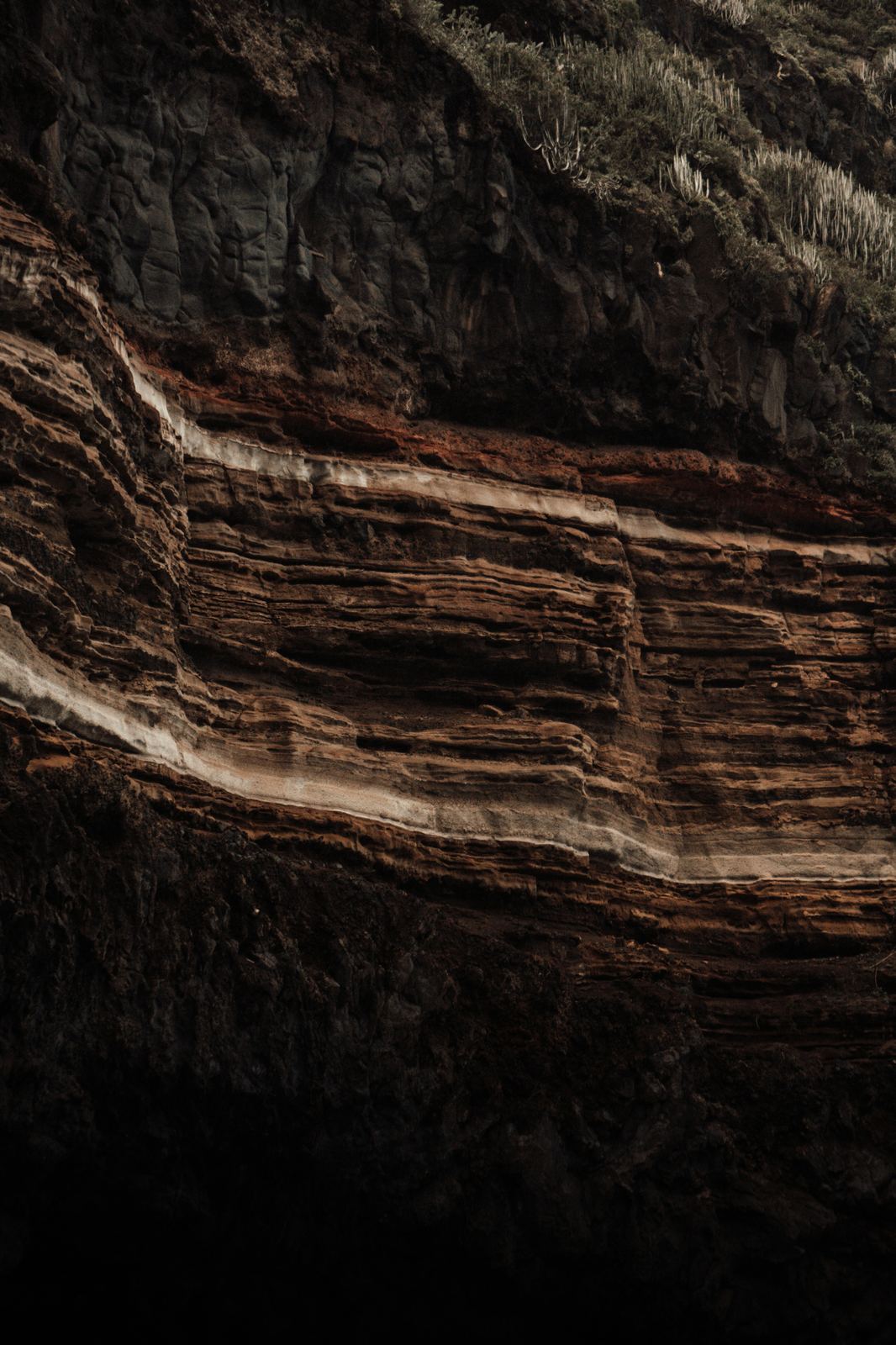 Layered brown rock formation strata