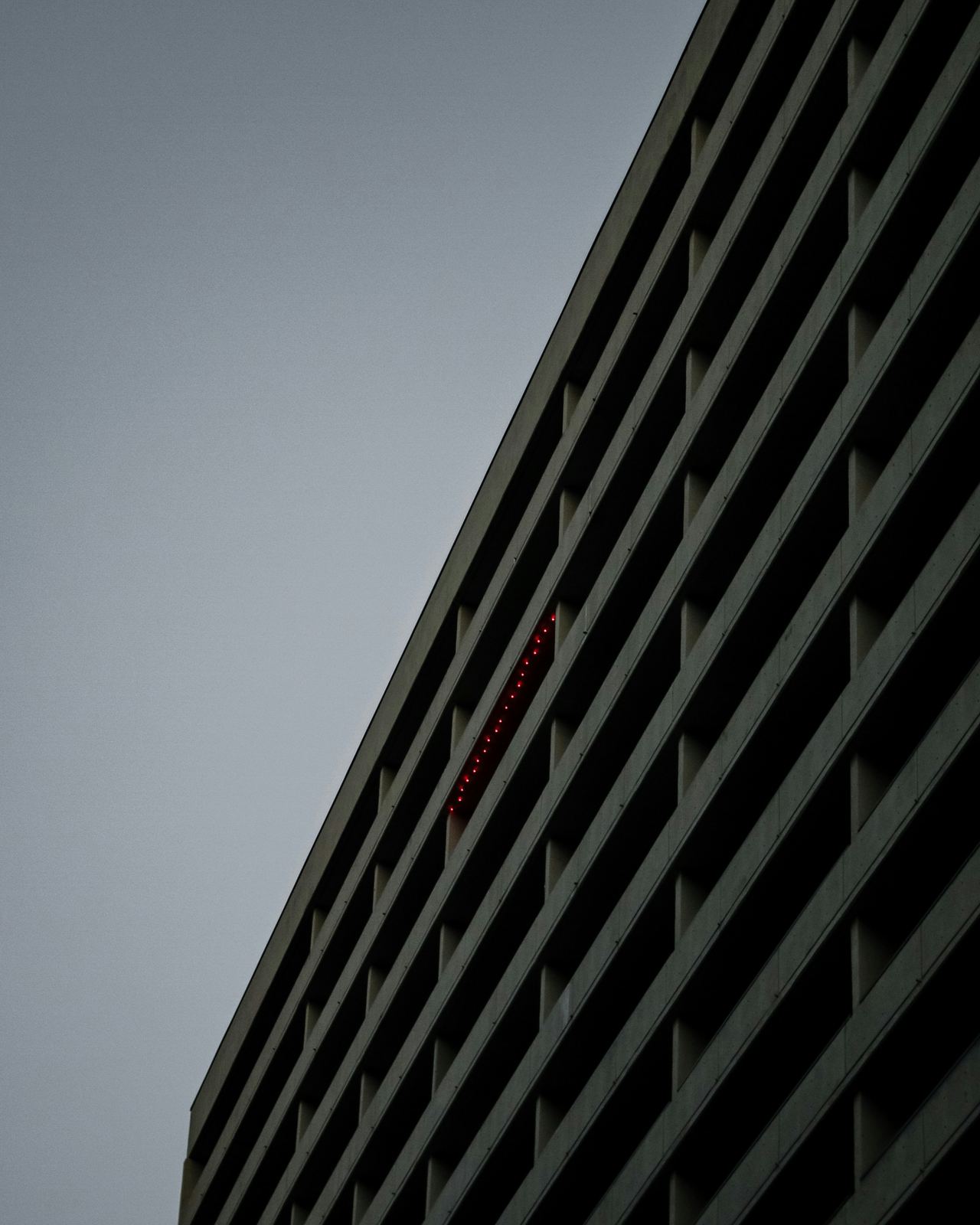 Modern condo building facade with a plain sky backdrop